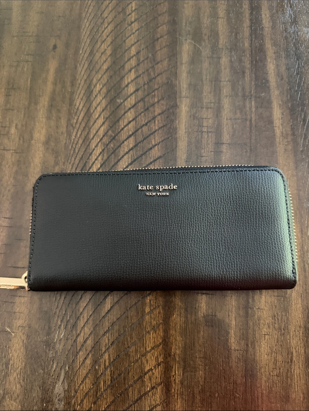 kate spade black leather zip-around wallet with gold logo